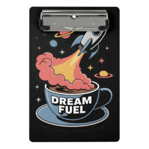 Traumtreibstoff-Grafik: Rakete startet aus Kaffee Mini Klemmbrett