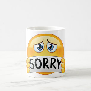 Trauriges Entschuldigung-Emoticon-Gesicht mit Ents Kaffeetasse