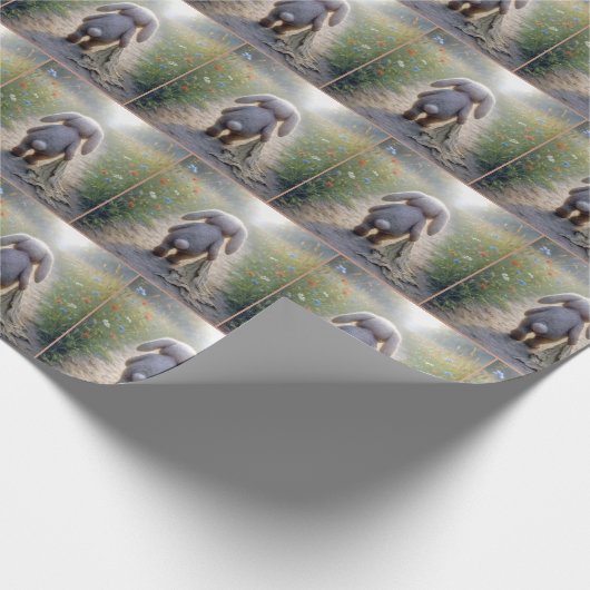 Trauriges Hasen mit Floppy-Ohr mit einem Knöchel Geschenkpapier (Ecke)