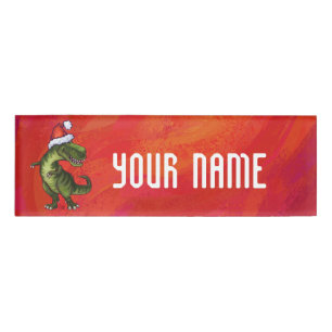 TRex Dino in Weihnachtsmannmütze auf Rot Namenschild