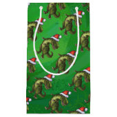 TRex in der Weihnachtsmannmütze auf Grün Kleine Geschenktüte (Vorderseite)