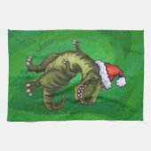 TRex in Weihnachtsmannmütze auf Grün Handtuch (Horizontal)