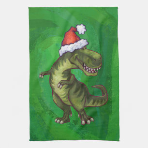 TRex in Weihnachtsmannmütze auf Grün Handtuch