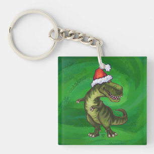TRex in Weihnachtsmannmütze auf Grün Schlüsselanhänger