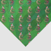 TRex in Weihnachtsmannmütze auf Grün Seidenpapier (Ausschnitt)