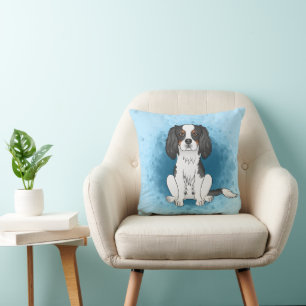 Tricolor Cavalier King Charles Spaniel Dog On Blue Kissen