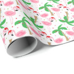 Tropical Beach Christmas Flamingos Birds Geschenkpapier<br><div class="desc">Weihnachtsgeschenk zum Thema Strand mit Flamingos mit Weihnachtsmannmützen. Ornamente und Lichter schmücken die Palmen. Wrap deine Geschenke in warmen Winter jubeln.  Sie können das Muster größer oder kleiner machen. Klicken Sie auf Anpassen und passen Sie die Größe mit den Plus/Minus-Schaltflächen an. Copyright Bendel Creative Design LLC Alle Rechte vorbehalten.</div>