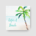 Tropical Beach Watercolor Palm Tree Leinwanddruck<br><div class="desc">Tropische Wandkunst auf eingewickelten Leinwänden mit einem landschaftlichen,  wasserfarbenen Strand und Palmenprint mit der Beschriftung "Life's a Beach". Caption kann einfach mit Ihrem eigenen Lieblings-Sprichwort angepasst werden - klicken Sie einfach auf "Personalisieren". Ideal für ein Strandhaus,  Küsten-Wohngestaltung oder überall,  wo Sie gewollt,  um eine entspannende Urlaubsatmosphäre hinzuzufügen.</div>
