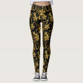 Tropische Blätter und Blume in Schwarz und Gold Leggings (Vorderseite)