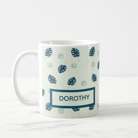 Tropische Monstera-Blätter Monogramm auf blau Kaffeetasse (Links)