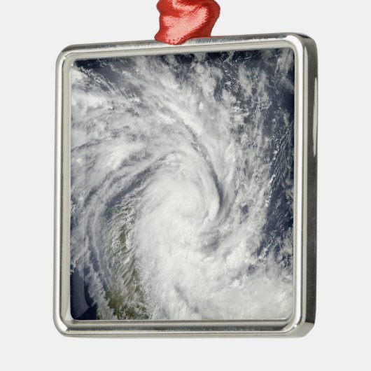 Tropischer Sturm Jade über Madagaskar Silbernes Ornament (Links)