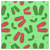 Tropischer Weihnachtsstrand Flip Flops und Holly Stoff (Nahaufnahme)
