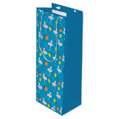 Tropisches Thema Flamingo Früchte auf blauem Hinte Geschenktüte Für Weinflaschen (Vorderseite Schrägansicht)