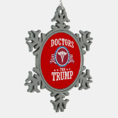 TRUMP-DOKTOREN SCHNEEFLOCKEN Zinn-Ornament (Links)