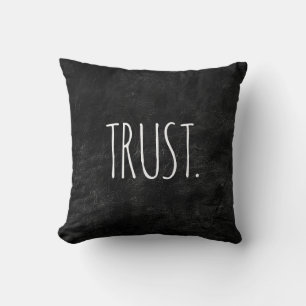 TRUST Text auf schwarzem Leder Kissen