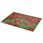 Tulpenfeld blüht im Frühling. Schneidebrett (Ecke)