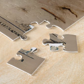 Türkises Boot an einem sandigen Strand Puzzle (Seite)