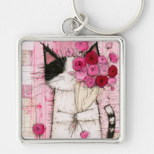 Tuxedo-Katze hält rosa Rosenbouquet Schlüsselanhänger
