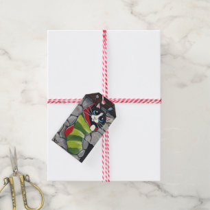 Tuxedo-Katze in ein gestreiften Geschenkanhänger