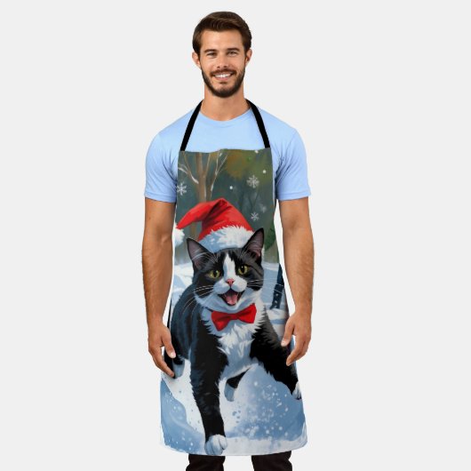 Tuxedo Katze läuft im Schnee mit Weihnachtsmütze Schürze (Getragen)