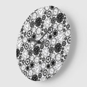 Two images show a round wall clock with a black  große wanduhr (Winkel)