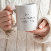 Typografie in einem Zusammenhang mit Kaffee Kaffeetasse