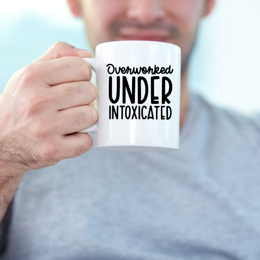Überarbeitet unter berauschtem, sonniger Arbeitspl Kaffeetasse