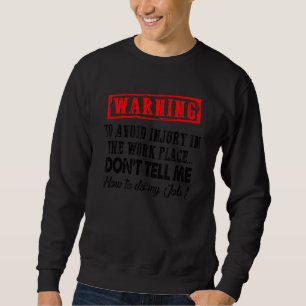 Um Verletzungen am Arbeitsplatz zu vermeiden, sage Sweatshirt