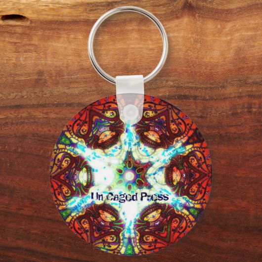 Un Caged Press Schlüsselanhänger (Vorderseite)