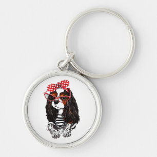 Unbekümmerter Königcharles Spaniel von Paris mit Schlüsselanhänger