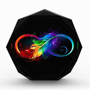 Unendliches Symbol mit Regenbogenfederhalter Fotoblock