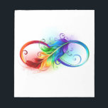 Unendliches Symbol mit Regenbogenfederhalter Notizblock<br><div class="desc">Künstlich gezeichnet Unendlichkeitssymbol mit schöner Regenbogenfeder auf weißem Hintergrund. Tattoo-Stil.</div>