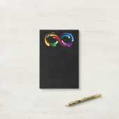 Unendlichkeitssymbol aus Regenbogenkometen Post-it Klebezettel (Auf Schreibtisch)