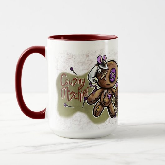 Unheil anrichtender Becher Tasse (Links)