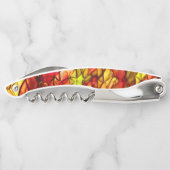 Unter einem roten Markisenstoff verborgene Kabel Kellnermesser (Rückseite)