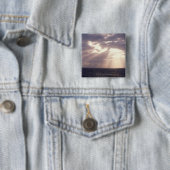 Untergehende Sonne, die durch Wolken über Ozean Button (Beispiel)