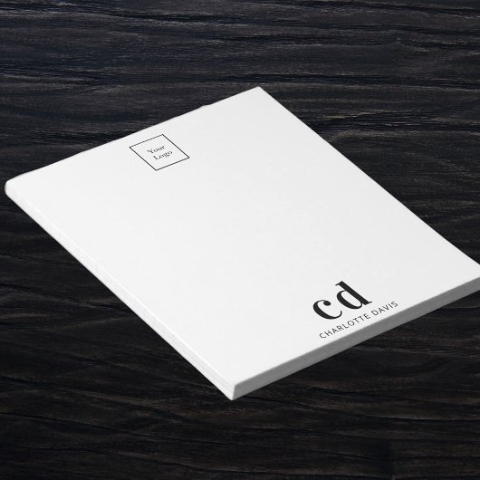 Unternehmen mit weißem Logo und schwarzem Monogram Notizblock