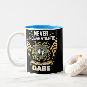 Unterschätze niemals die Macht eines Gabe Zweifarbige Tasse