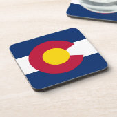 Untersetzer aus hartem Kunststoff mit der Fahne Co (Linke Seite)