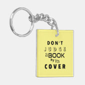 "Urteile ein Buch nicht nach seiner Abdeckung" hel Schlüsselanhänger (Vorderseite links)