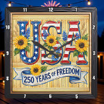 USA 250 Years Freedom Sunflower Quadratische Wanduhr<br><div class="desc">Celebrate a historic quarter-millennium with the "250 Years of Freedom" Sunflower clock. This high-energy timepiece features a high-definition graphic that blends patriotic pride with natural beauty. The design centers on bold, stylized "USA" lettering filled with stars and stripes, prominently accented by vibrant, sun-drenched sunflowers and blue wildflowers. A graceful white...</div>