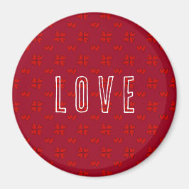 Valentinins rotes Herz auf der roten Liebe Magnet