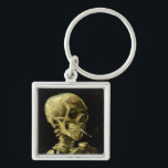 Van Gogh Smoking Skeleton Schlüsselanhänger<br><div class="desc">Schlüsselanhänger mit Vincent van Goghs Ölgemälde Skull of a Skeleton with Burning Cigarette (1885-86). Ein großartiges Geschenk für die Fans von Post-Impressionismus und holländischer Kunst!</div>