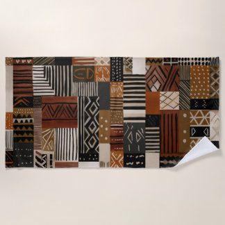 Variations of African motifs in earth tones Strandtuch