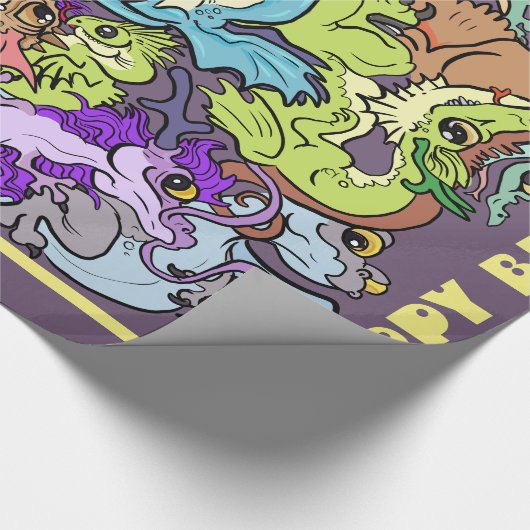 verpackt in Party Dragons Geschenkpapier (Ecke)