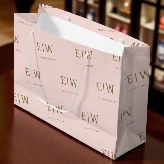 Verpackung von Unternehmen mit rosa und goldener M Große Geschenktüte