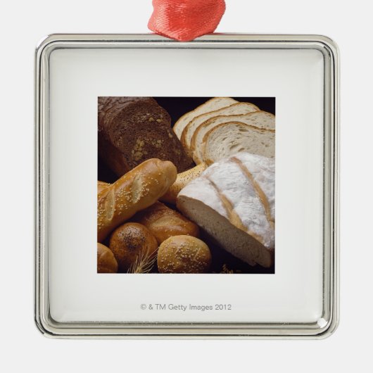 Verschiedene Arten des Handwerkerbrotes Silbernes Ornament (Vorne)