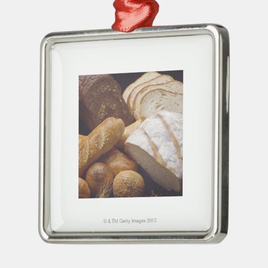 Verschiedene Arten des Handwerkerbrotes Silbernes Ornament (Links)