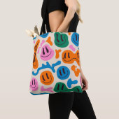 Verschiedene farbenfrohe, schmelzende Gesichter. L Tasche (Von Nahem)