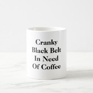 Verschrober schwarzer Gürtel mangels des Kaffees Kaffeetasse